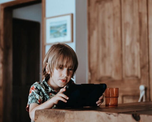 child with an iPad